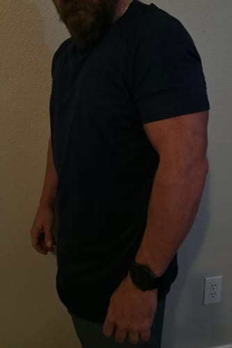 Man who is 5'7" wearing a size M PrimeCut tee in black
