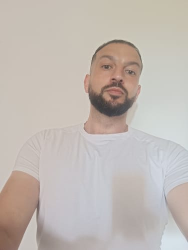 Man who is 5'7" wearing a size L PrimeCut tee in navy