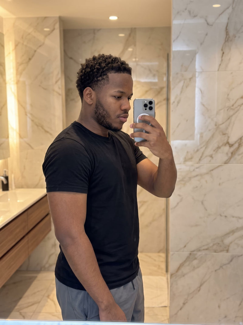 PrimeCut customer wearing the black tee